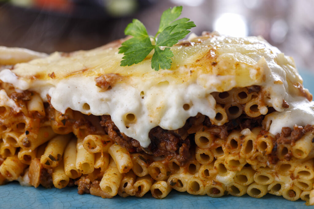 greek Pastitsio dish on a blue plate